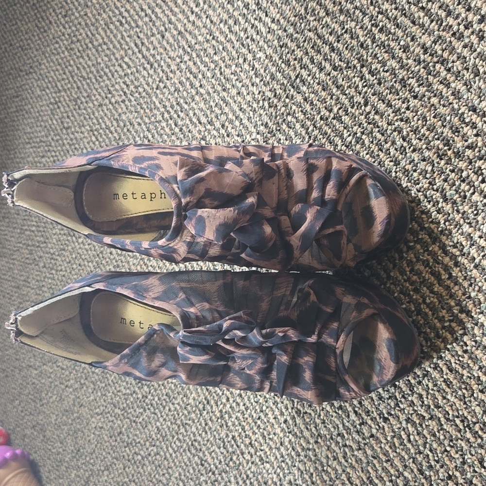 Metaphor cheetah print stilleto pump heels peep toe covered foot